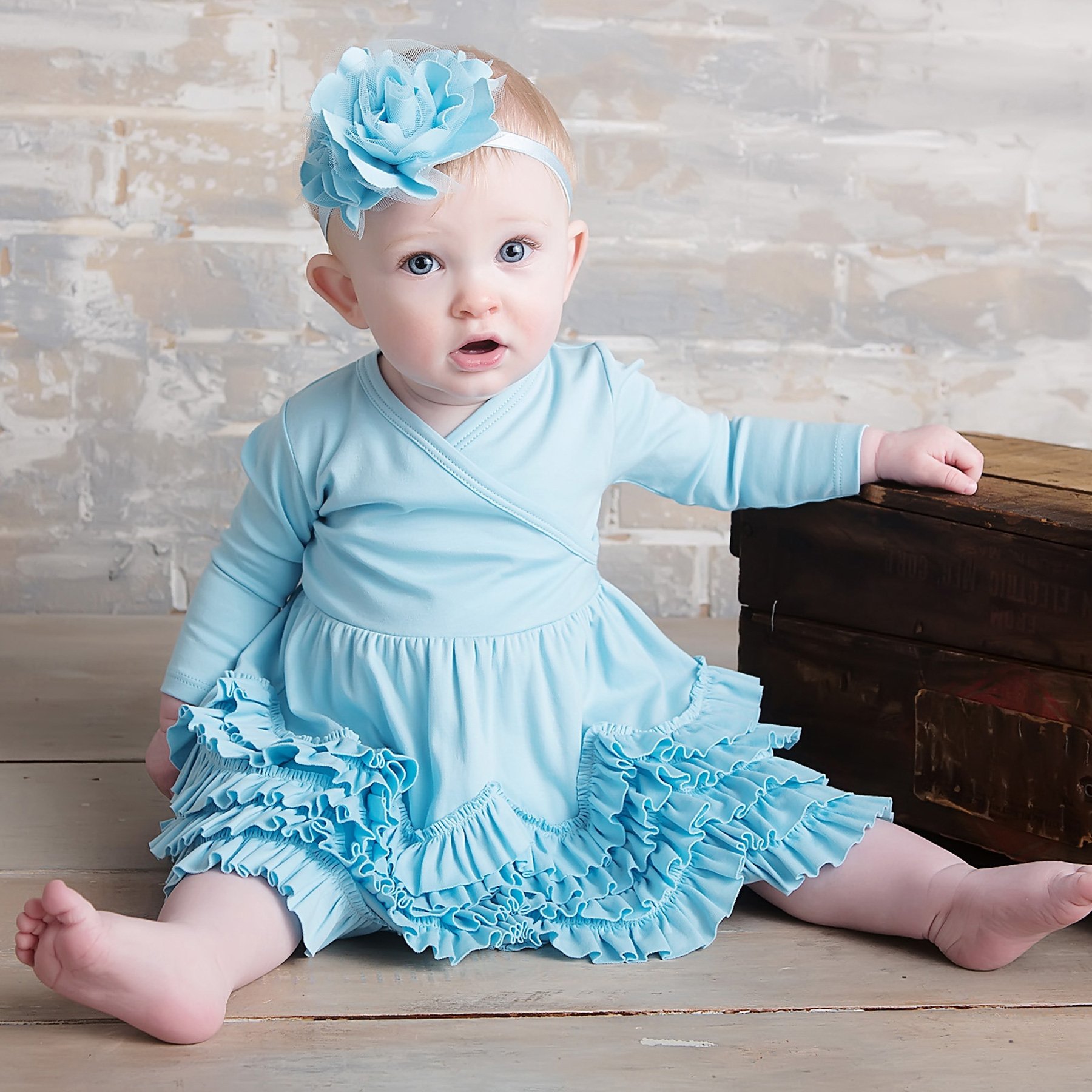 baby girl in blue dress